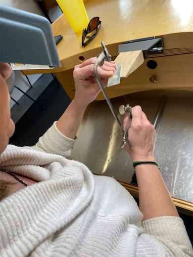 Student using a jeweler's saw